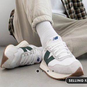 New Balance 237 sneakers in white and green